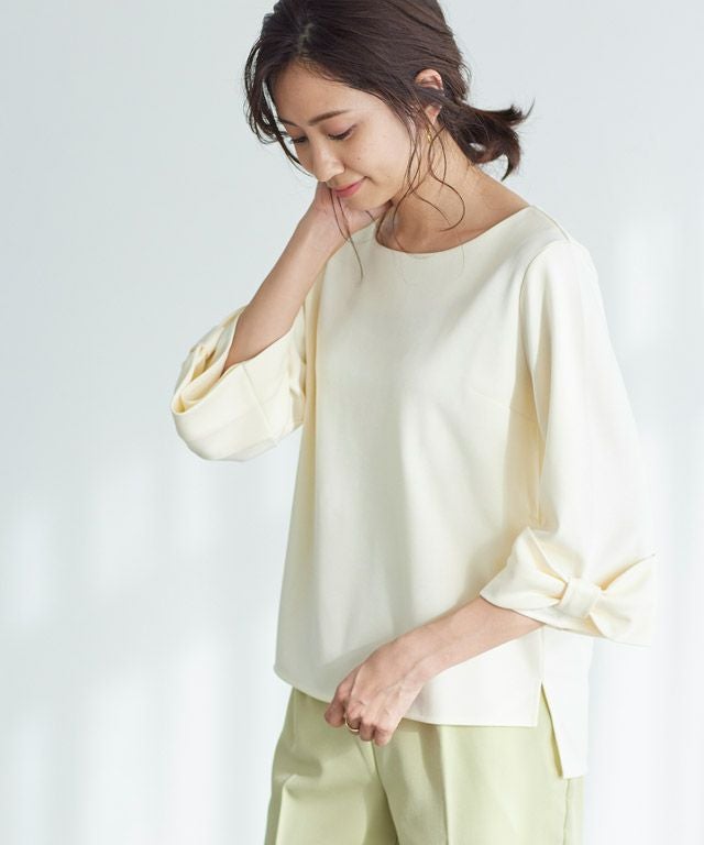 ポンチ素材袖リボントップス